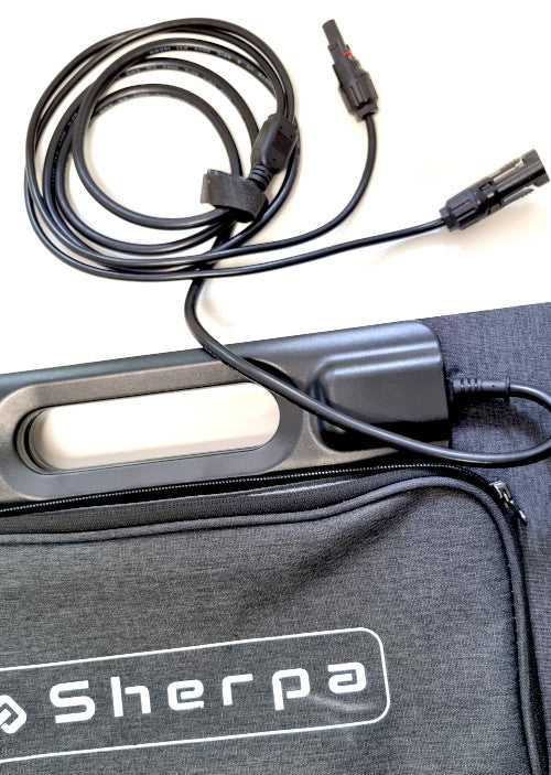 Close up of cable slate grey fabric pouch with ‘Sherpa’ branding and solar MC4 cables displayed on white background