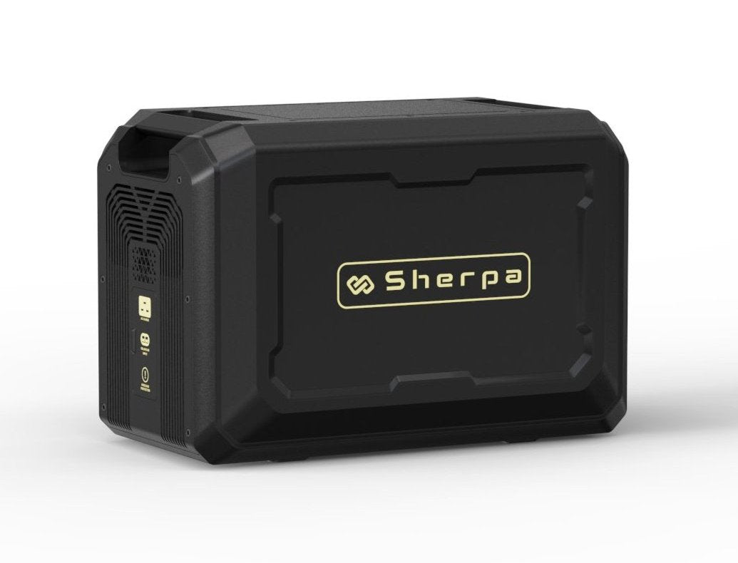 Left rear shot of portable power unit with large gold Sherpa logo, featuring charge ports for mains, solar and car charge