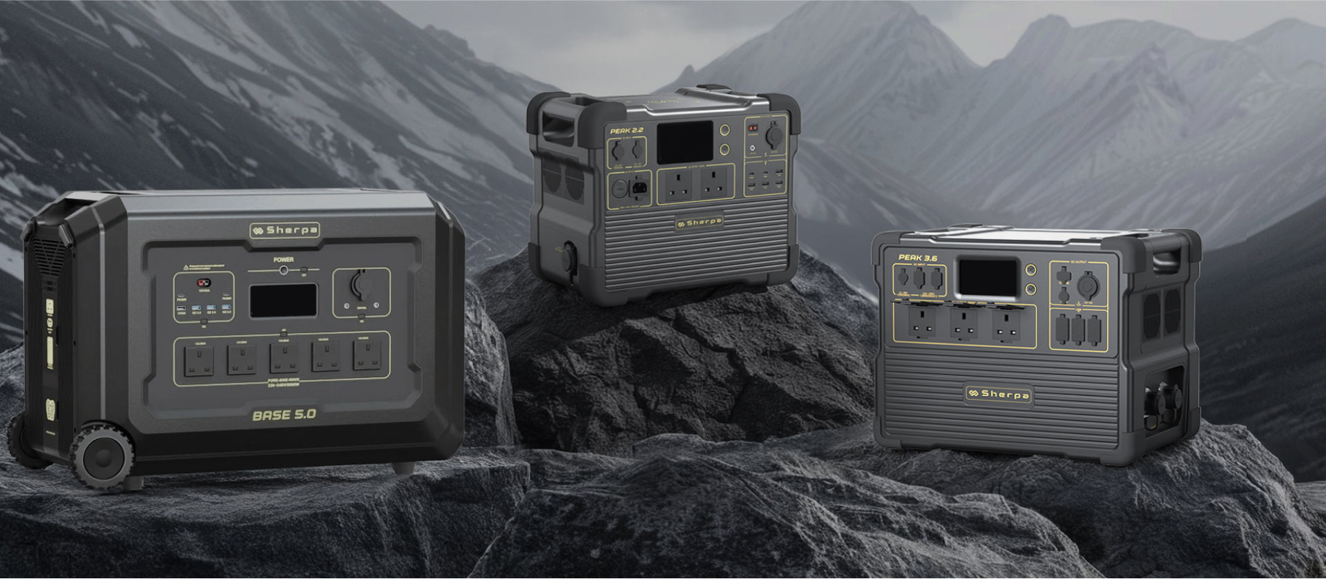 Three portable power stations on a rocky surface with mountainous background